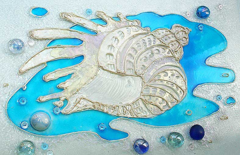 A shell glass decor detail used textural elements and blue glass paint