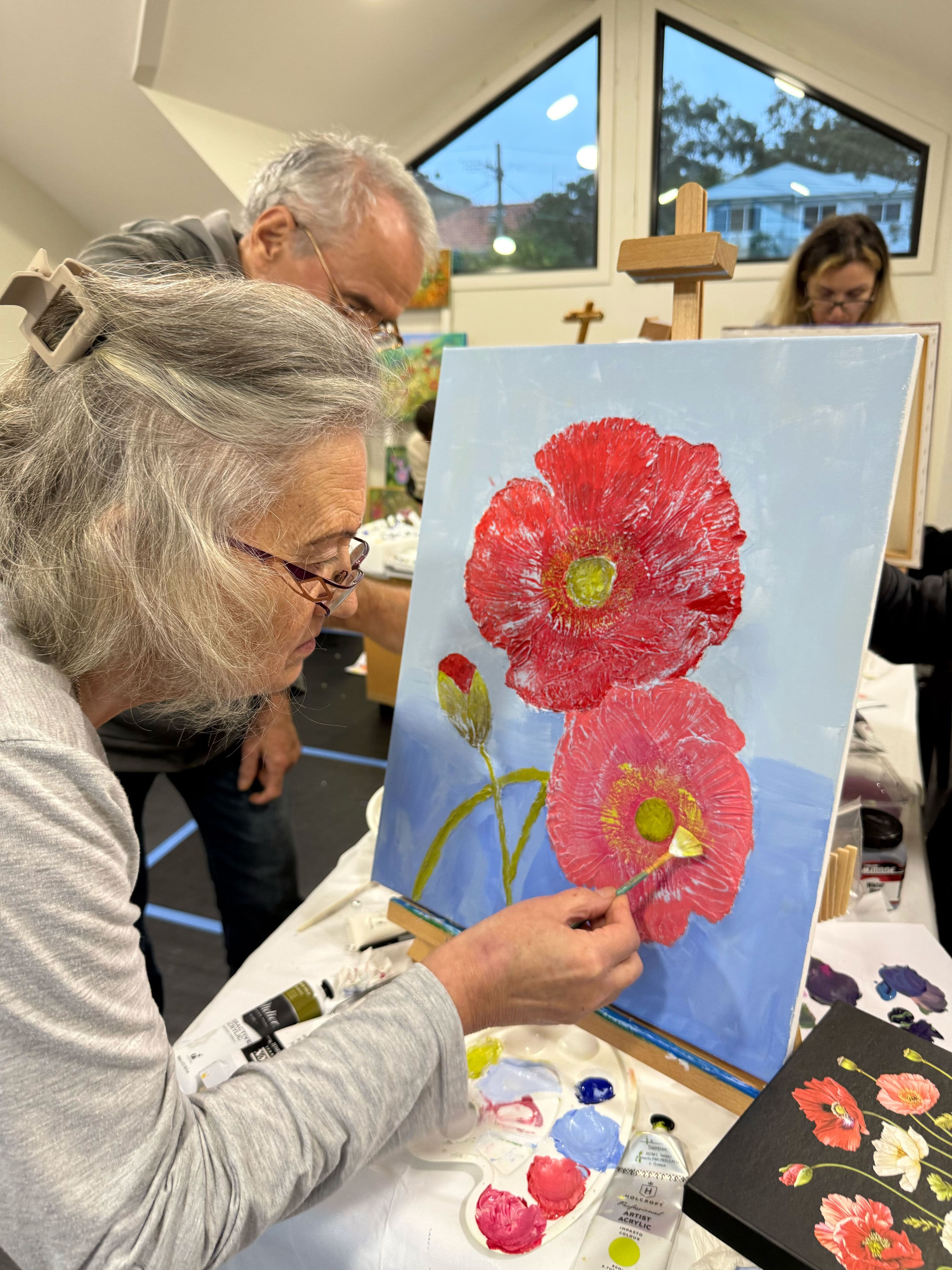 Small group working in artists studio