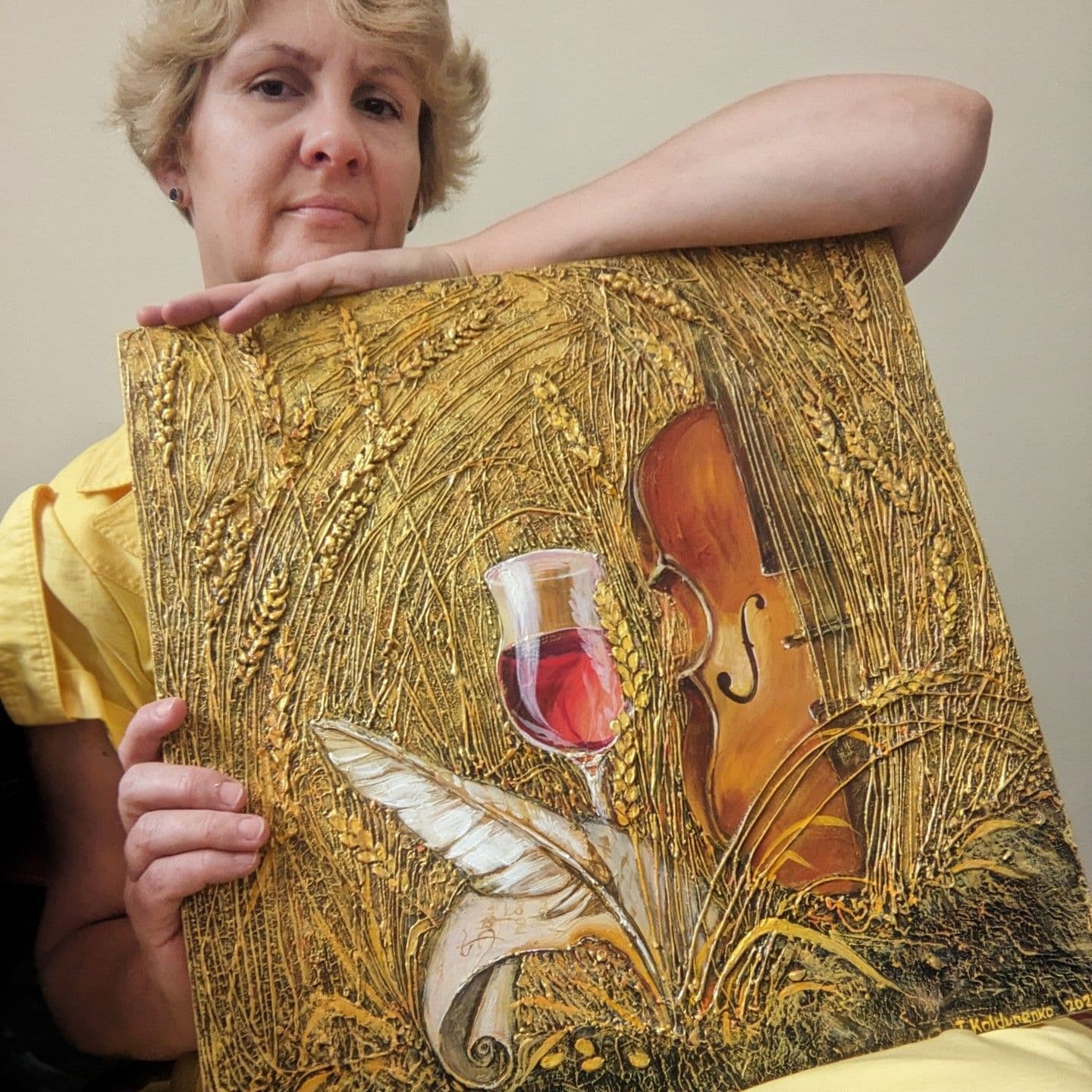 Artist holding the artwork