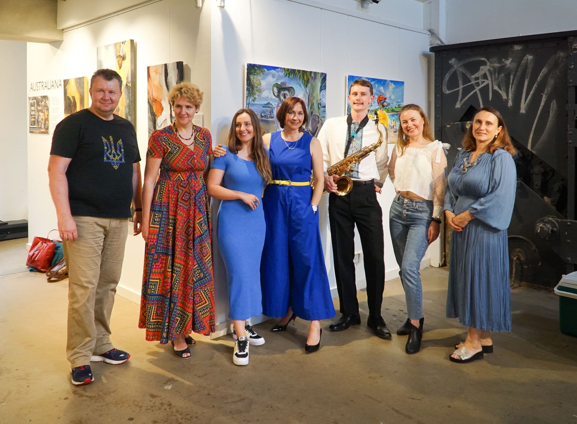 Group of artists, musician and Embassy representative at the opening event