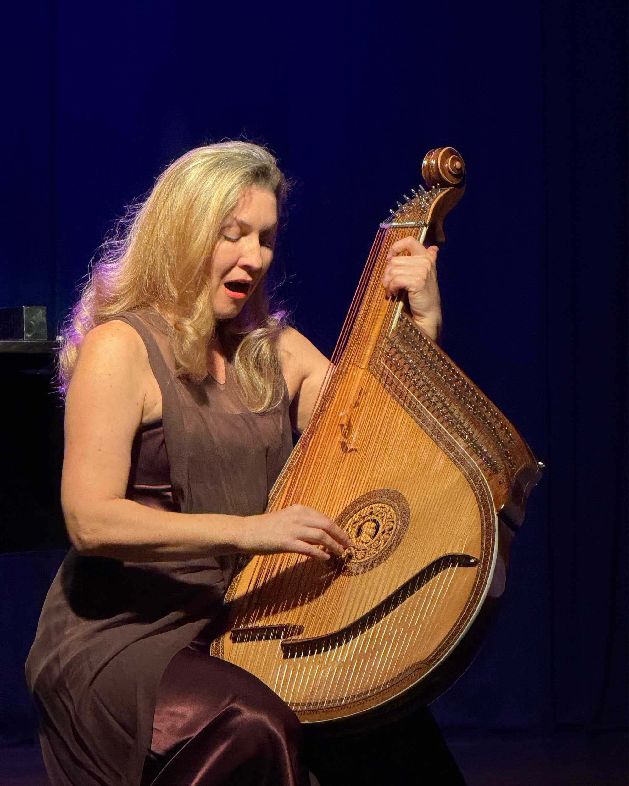 Larysa Kovalchuk is singing and playing bandura