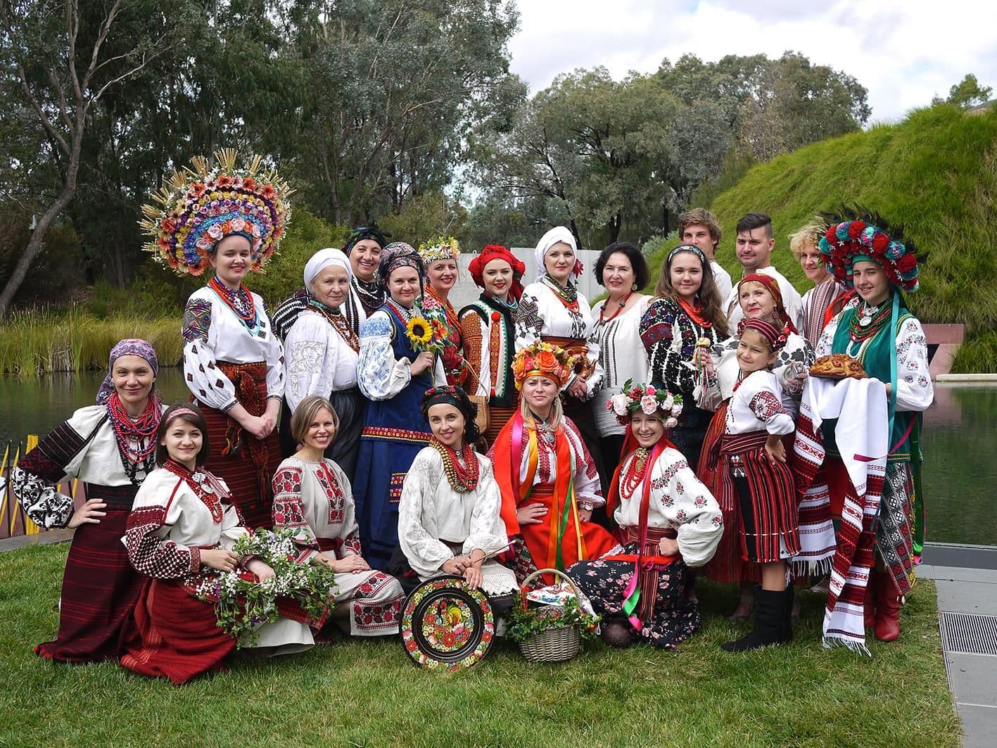 Models in traditional outfits in front of NGA